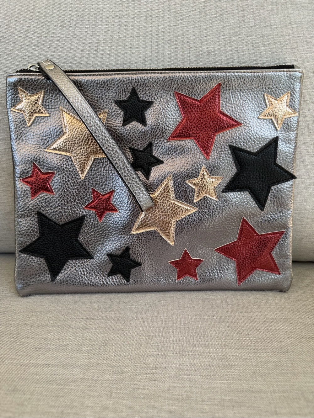 Metallic Silver Star Appliqué Wristlet Clutch - with Gold, Red & Black Stars